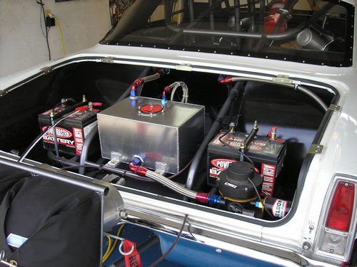 Outlaw 1966 Nova, inside trunk showing fuel cell, monster fuel pump and batteries.